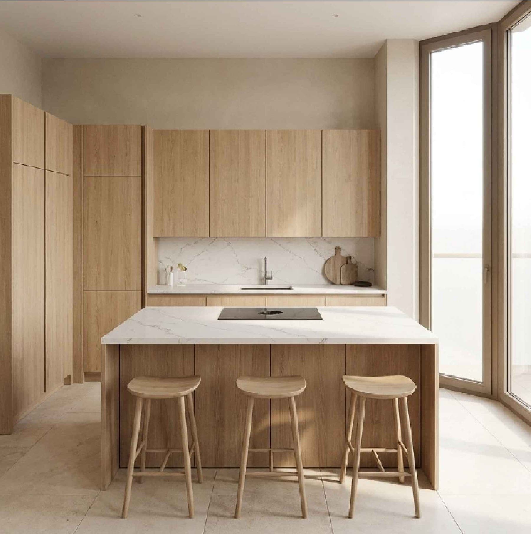 Cuisine : îlot en pierre claire, façades en chêne, tabourets en bois